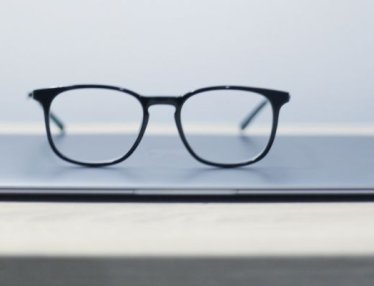 glasses sitting on notebook computer