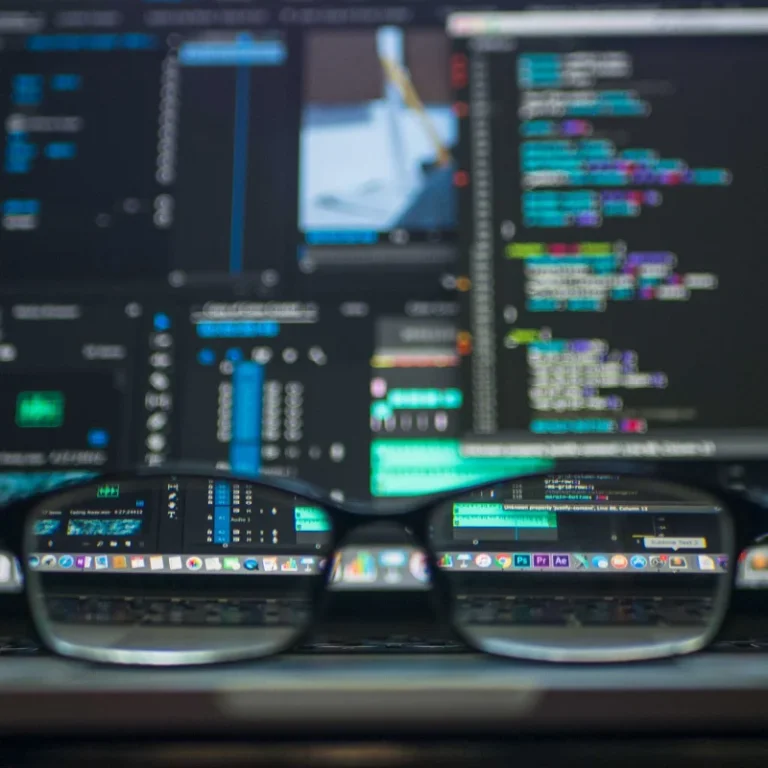 Custom Web Design image looking through glasses at a blurry computer screen