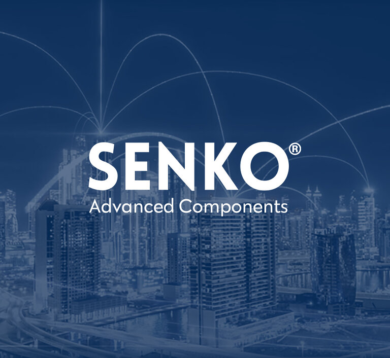 SENKO Advanced Components logo over a city skyline