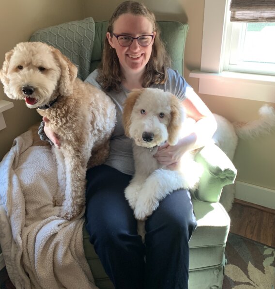 Web Support Representative, Clare Lewis with her dogs.