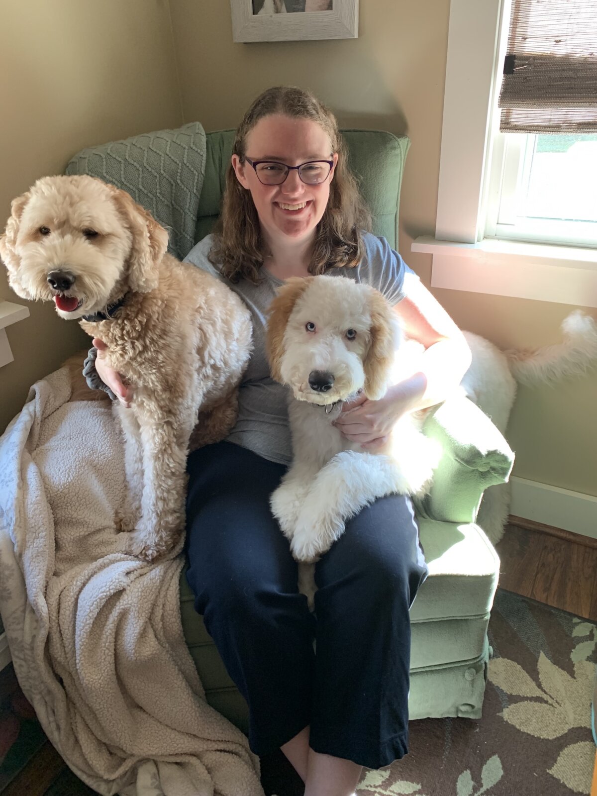 Web Support Representative, Clare Lewis with her dogs.