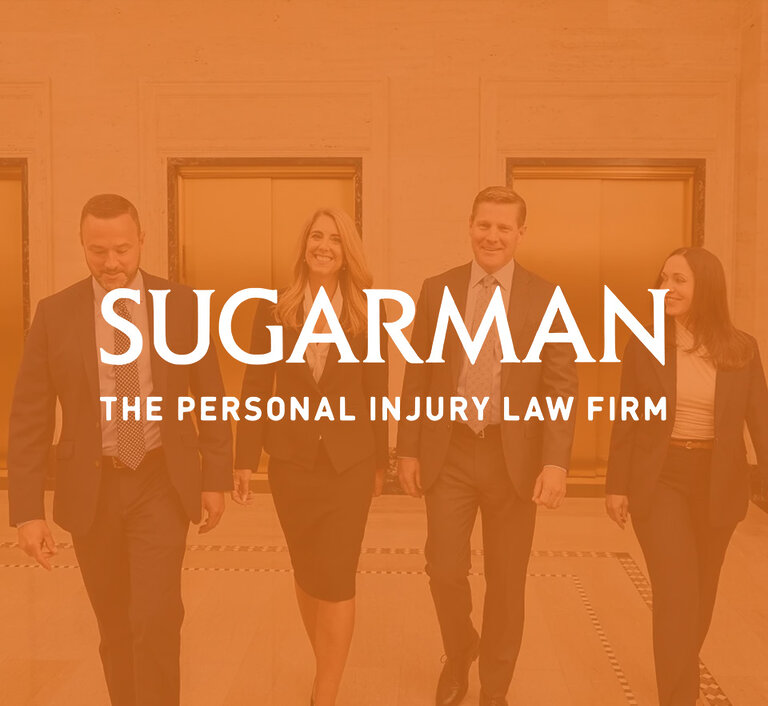 Sugarman law firm website hero with four attorneys walking through a lobby.