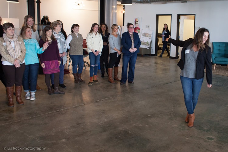 Lysa Miller (3 Media Web, MetroWest Women's Network) gathering the crowd for a live video.