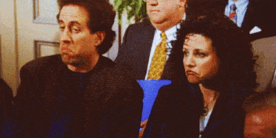 Seinfeld GIF with both characters glancing at each other