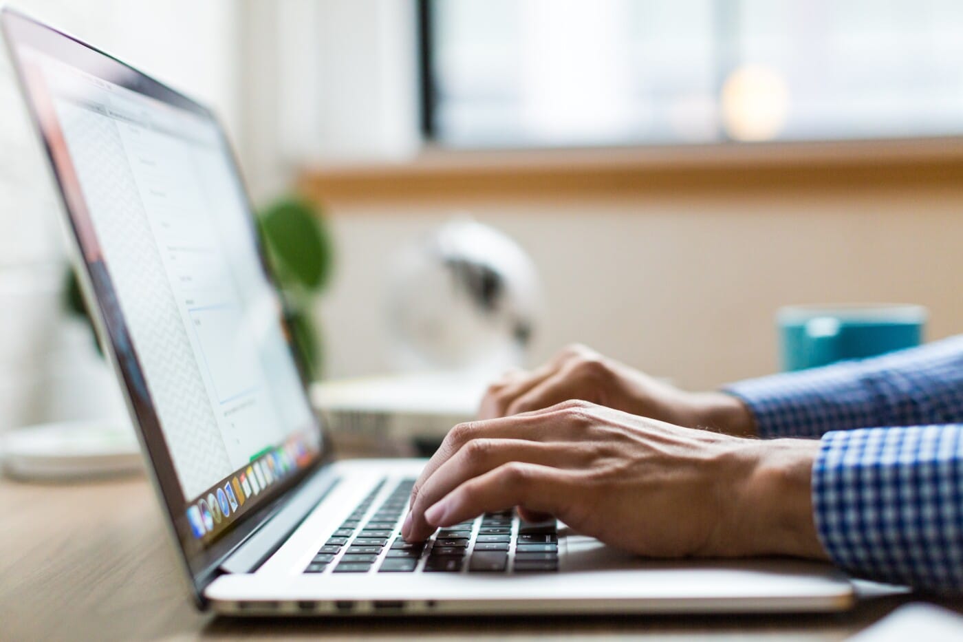 back end web developer typing on computer