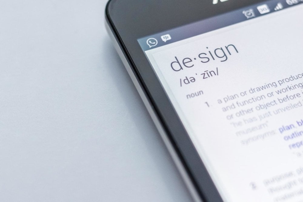 smartphone with definition of b2b website design in it